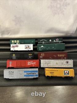 Lot de 10 wagons de marchandises pour train miniature à l'échelle N. Super Therm, Pepsi Cola, etc.